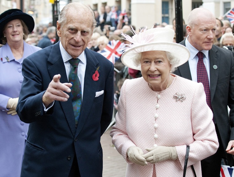 Image: Britain's Queen Elizabeth and Prince Phillip walks through the old town during a visit to Margate, in Kent, southern England